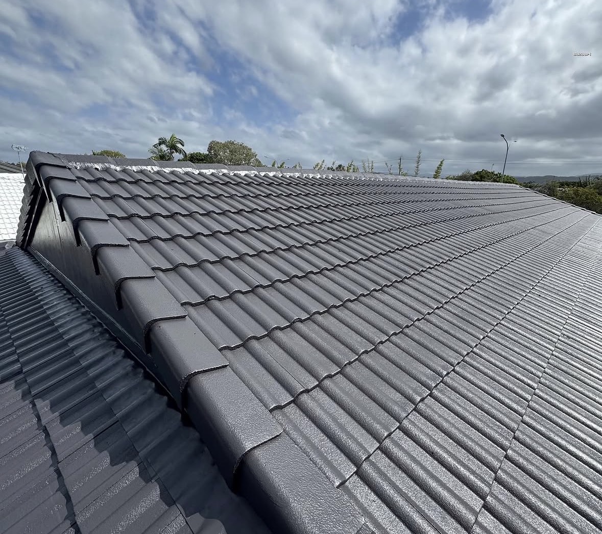 Charcoal tiled roof restoration by BGT Roofing on the Gold Coast